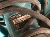 a close up of a blue machine with a bunch of wires on it