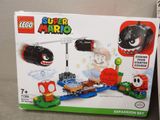 a box of legos with a picture of mario and other toys