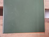 a blackboard sitting on a wooden table in a room