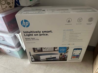 a box that is sitting on the floor next to a pile of boxes