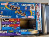 several boxes of toys are stacked on top of each other on the floor
