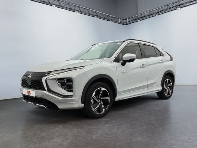 a white suv parked inside of a building with a white wall