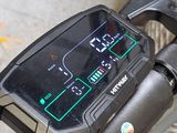 a close up of a bike with a display on the handlebar