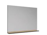 a white mirror with a wooden shelf on top of it