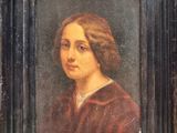 painting of a woman in a red dress in a black frame