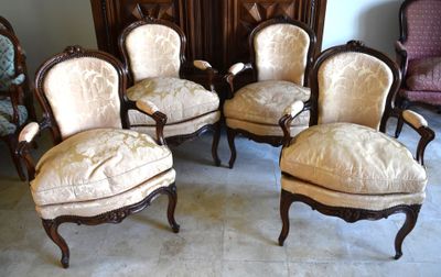 four chairs that are sitting in a room together