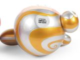 a toy that looks like a pig with a gold and white design on it
