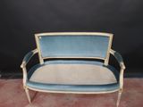 an image of a blue and white chair sitting on top of a carpeted floor