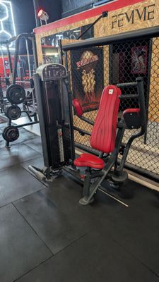 a gym room with a bench, weights, and other equipment