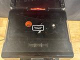 a small machine that is sitting on a wooden table