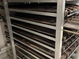 an image of a rack of doughnuts in a commercial kitchen