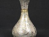an antique silver vase on a black background with a black background