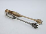 a pair of spoons sitting on top of a white surface