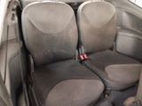 two seats in the back of a car with a seat belt