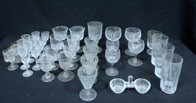 a lot of glasses that are sitting on a table
