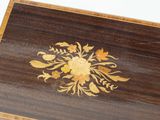 a wooden box with a floral design on it