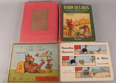 quatre livres pour enfants sont alignés sur une surface blanche