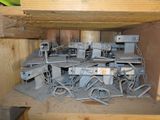 a wooden shelf with a bunch of electrical equipment in it