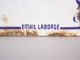a sign that says email laborde on the side of a building