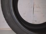 a close up of a tire on a white surface with a white background