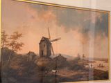 a painting of a windmill on the wall of a room