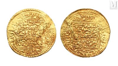 a close up of two gold coins on a white background