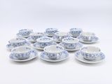 blue and white tea cups and saucers on a white background