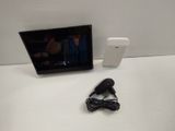 a picture of a tv and a hair dryer sitting on a table