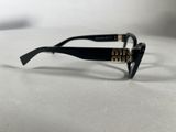sunglasses on a table with a white table cloth and a white background