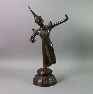 bronze statue of a woman holding a sword on a pedestal