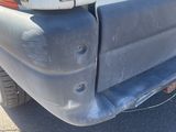 the rear end of a truck with a flat tire and a flat tire