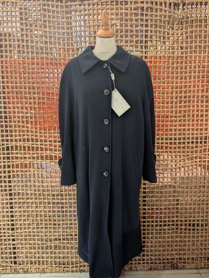 the coat is black and has a white tag on it