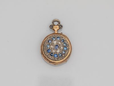 a gold and blue diamond pocket watch