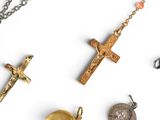 several different religious items are arranged on a white surface