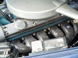 a close up of a car ' s engine with the hood up