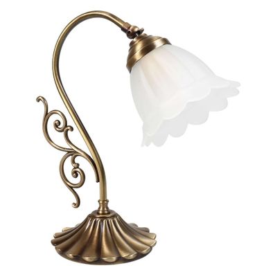 une lampe de table en laiton surmontée d'un abat-jour en verre blanc