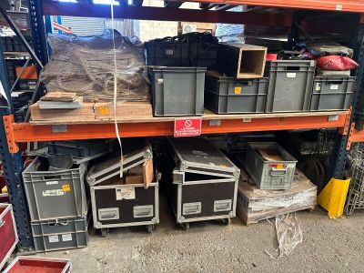 many boxes and crates on the shelves in the warehouse