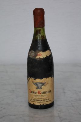 a bottle of wine that is sitting on a table