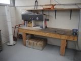 a workbench in a garage with a lot of tools on it