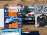 many books that are sitting on top of a table