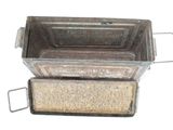 two metal pans sitting on top of each other