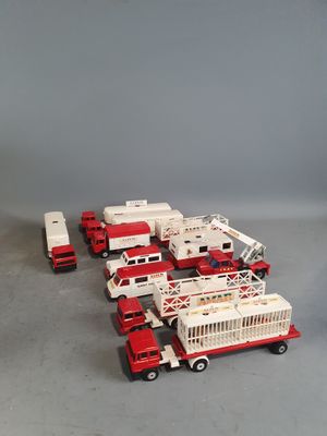 a lot of toy fire trucks that are on the floor