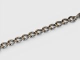 a close up of a chain on a white surface