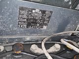 a close up of a gas stove with a lot of hoses