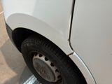 a close up of a white car with a flat tire