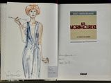 three books with drawings of a woman in a dress and a man in a suit