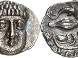 une pièce de monnaie en argent portant l'image d'un visage d'homme