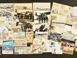 a lot of old postcards on a black surface