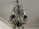 a chandelier hanging from the ceiling in the kitchen