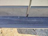 a close up view of a car ' s bumper with a hole in it